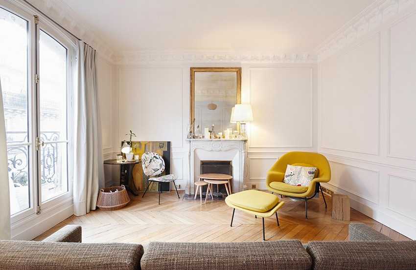 découvrez comment allier l'élégance de la décoration haussmannienne avec une touche moderne pour un intérieur chic et intemporel.