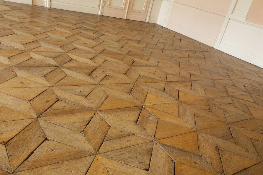 découvrez nos services de rénovation de parquet haut de gamme à versailles, alliant savoir-faire traditionnel et matériaux de qualité pour sublimer votre intérieur.